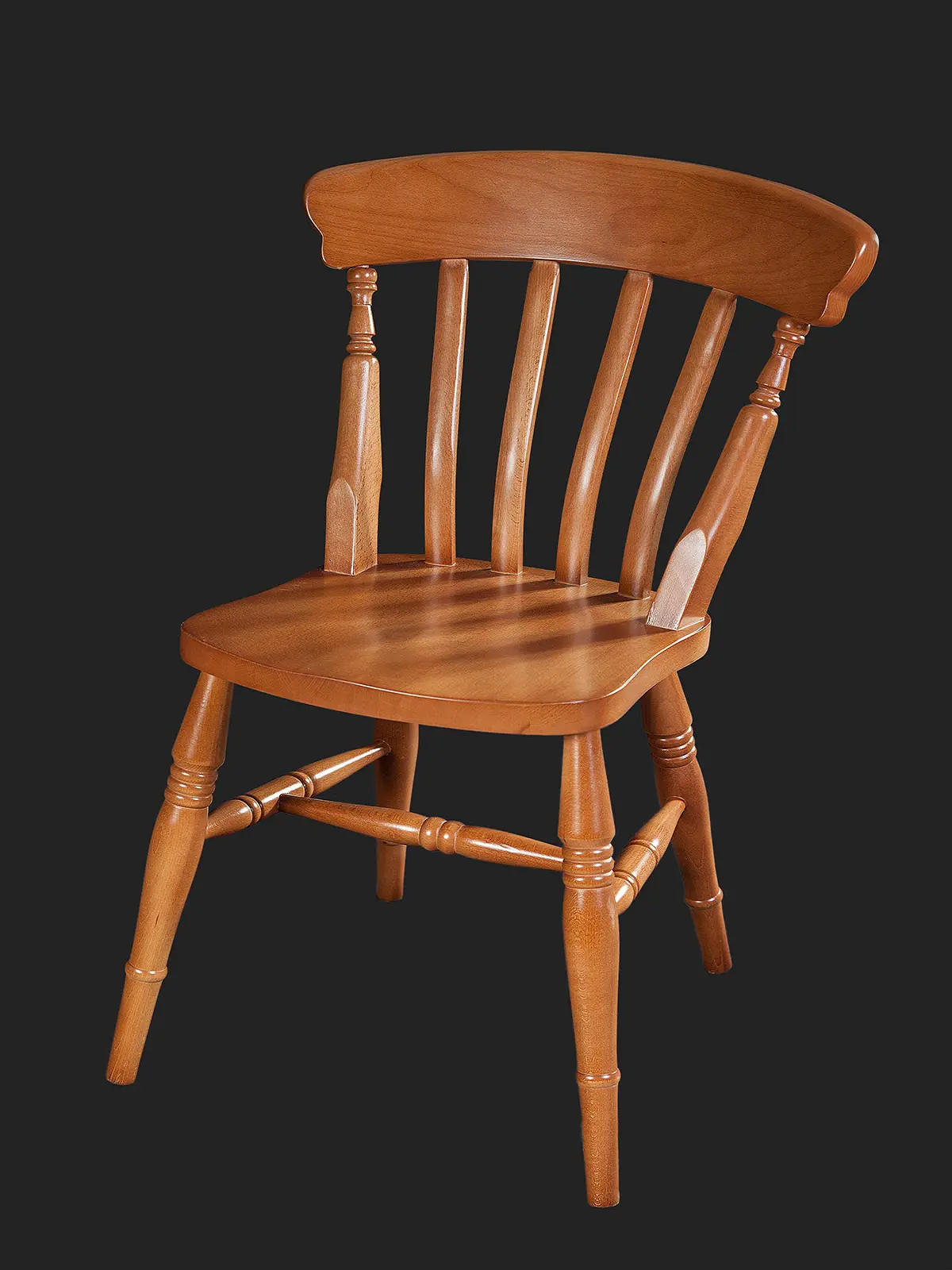 A classic wooden chair with a slatted back and sturdy legs, isolated on a dark background.