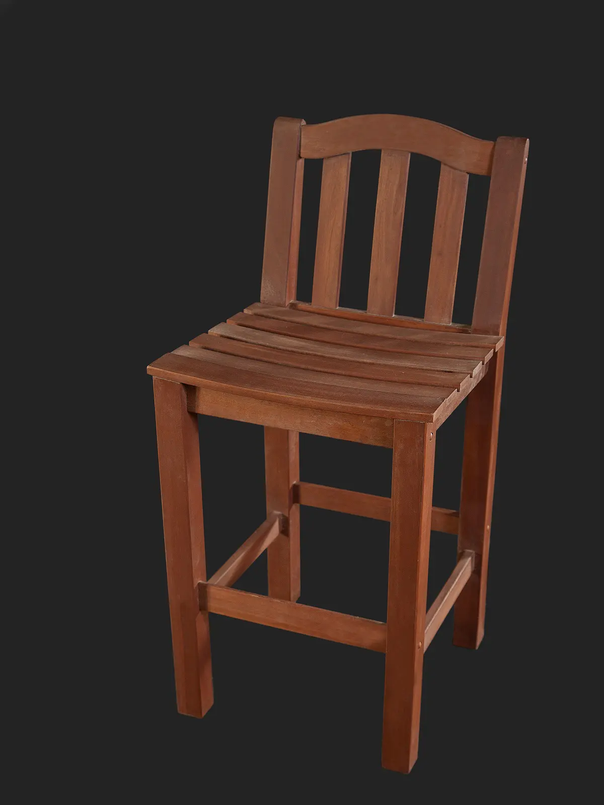 A wooden bar stool featuring a slatted seat and a classic design against a dark background.