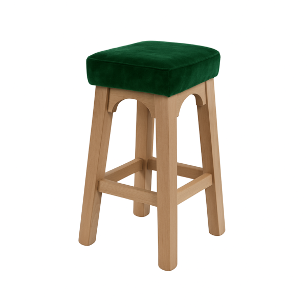 A green velvet bar stool featuring a wooden frame, ideal for modern decor.