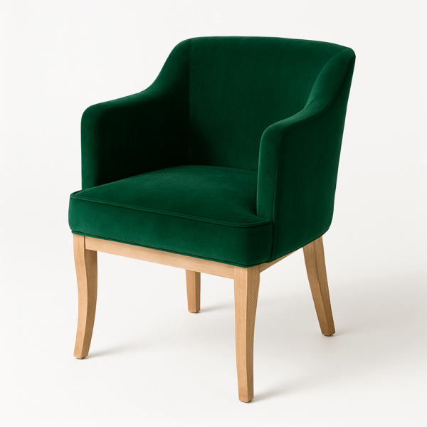 Green velvet accent chair with curved armrests and wooden legs on a neutral background.