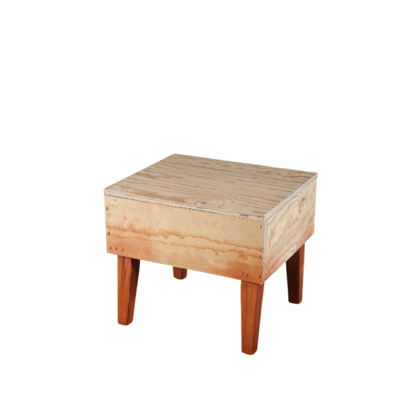 A minimalist wooden Cube Foot Stool with four wooden legs, featuring a natural finish.