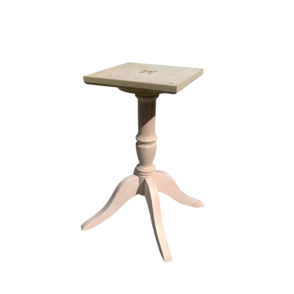 A stylish vintage pedestal table with a square top and a decorative design, perfect for home decor.