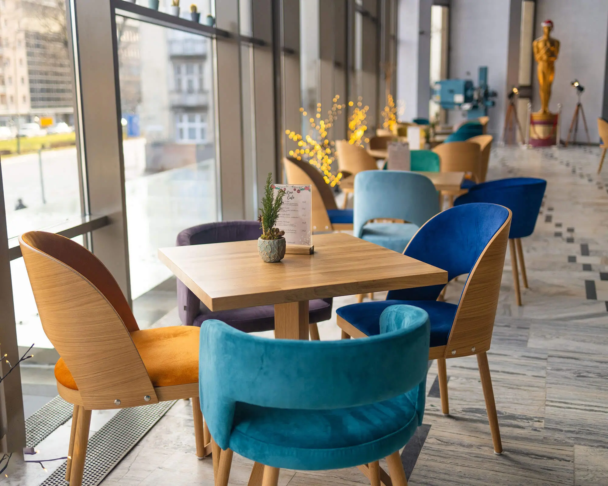 modern-white-cafe-interior-with-color-tables-with