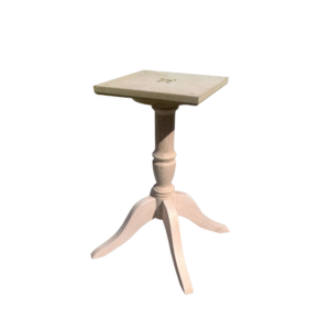 A stylish vintage pedestal table with a square top and a decorative design, perfect for home decor.
