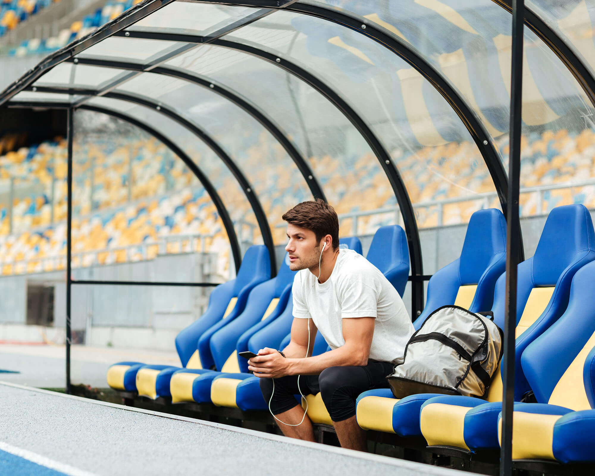 image-of-serious-young-sports-man-at-the-stadium
